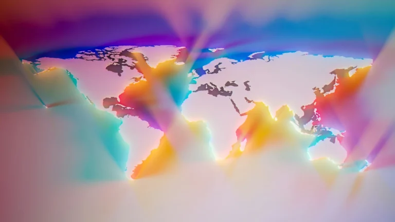A map of the world with the oceans and seas filled with random rainbow colors that are reflecting and spilling across each other like light